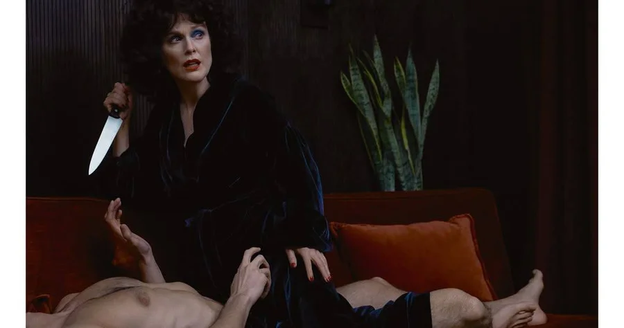 Julianne Moore holding a knife, recreating a Blue Velvet scene, photographed by Luca Guadagnino