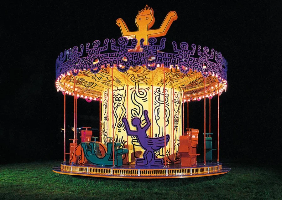 Keith Haring's illuminated carousel for Luna Luna at night