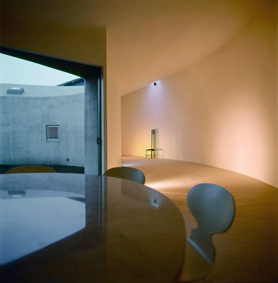 White U House interior, dining table and courtyard view